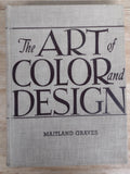 A square fabric-covered book or album cover titled 'The Art of Color and Design' by Maitland Graves, featuring large black serif typography on a light beige linen-like background, photographed from above on a light wood surface.